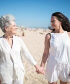 Mother and Daughter Holding Hands at the Beach