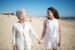 Mother and Daughter Holding Hands at the Beach